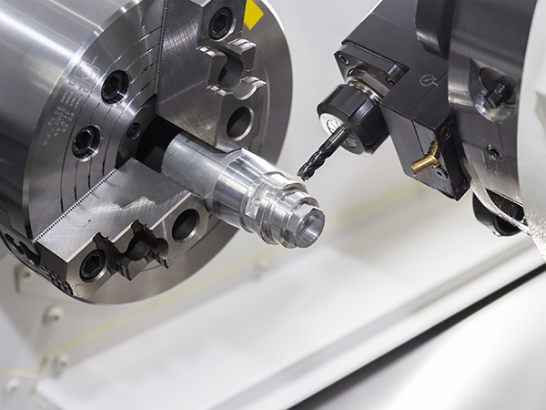 Steel metal cutting machine process by CNC lathe in workshop